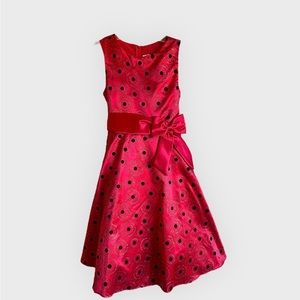 *2 for $20* Red dress with black & silver designs and side bow. Size juniors 14.